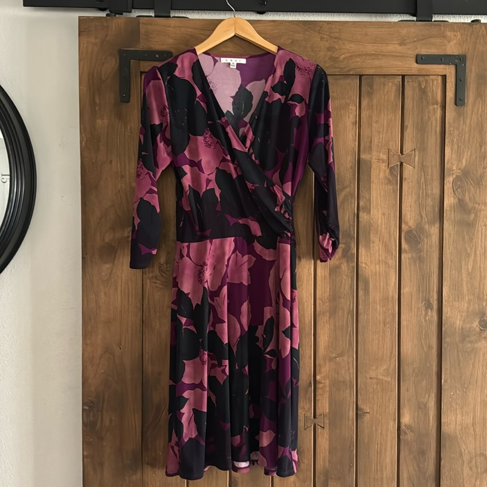 Blue, pink, and black medium length dress. 3/4 length sleeve. wrapped  v-neck